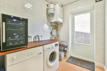 Laundry Room With Washing Machine And Wine Cooler