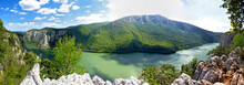 Mountain Panorama And Big River Flowing Through Mountains