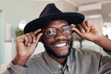 Poster - If they're funky, they're for me. Shot of a young man buying a new pair of glasses at an optometrist store.