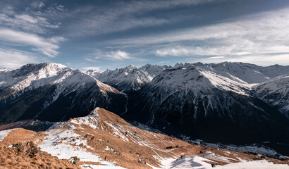 Wall Mural - Panoramic view of mountain range of the Caucasus Mountains. View from the top of the mountain. Elbrus region
