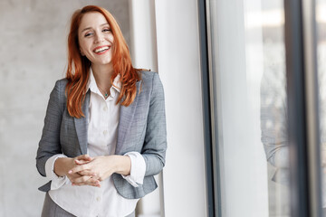 Corporate portrait of successful businesswoman at the office.	
