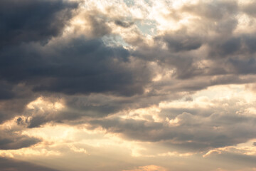 Wall Mural - clouds on the sky in golden hour light. warm weather in summer at sunset
