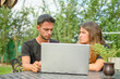 © Aleix - Emotion. Young caucasian couple arguing looking at their laptop.