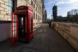 Fototapeta  - Typical phone box with Big Ben Tower