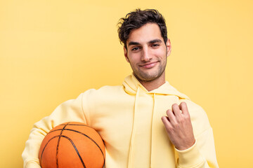 young handsome hispanic man. basketball concept