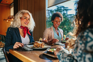 Wall Mural - Three business women having lunch break