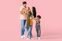 Happy Dancing Family On Color Background