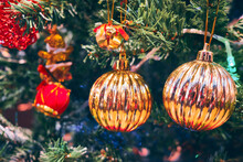 Golden Colored Spheres At New Year Tree. New Year Decorations. Christmas Tree.