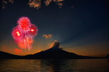 Firework Display Over Lake Against Sky With Mount Fuji