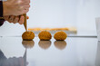 Filling choux a la creme in reflexion by chef hands
