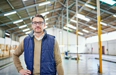 Wall Mural - Organization is key in distribution. Portrait of a man working in a distribution warehouse.