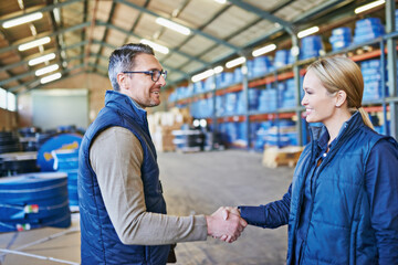 Poster - Awesome job on that last project. Shot of two people whaking hands while working in a warehouse.