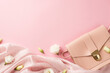 Top view photo of woman's day composition pink leather purse soft cloth and white prairie gentian flower buds on isolated pastel pink background with copyspace