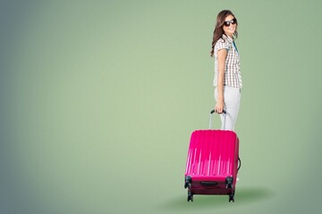 Wall Mural - Full length traveler tourist woman in casual clothes hold suitcase