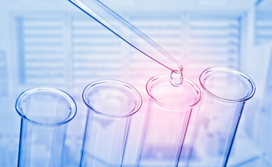 Wall Mural - lab scene with pipette and test tube in blue with red focus