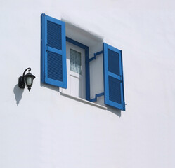  blue window on the white wall