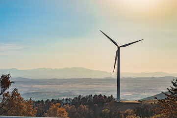 Power of wind turbine generating electricity clean energy with blue background on the sky.Global ecology.Clean energy concept save the world