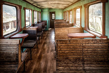 Interior Of Railway Passenger Carriage. Vintage Atmosphere. Wooden Benches And Historic Railway Design.