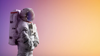 Leinwandbilder - Astronaut stay on isolated background with gradient color. Spaceman alone. Creative sci-fi space wallpaper with light. Elements of this image furnished by NASA