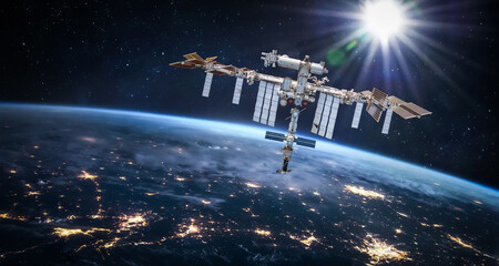Leinwandbilder - International space station in 2022 in outer space with Earth at night. ISS floating on orbit of nightly Earth planet. Elements of this image furnished by NASA