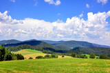 Fototapeta  - Beautiful summer landscape in the mountains with green meadows and forested hills, Low Beskids (Beskid Niski), Poland 
