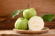 Fresh organic guava fruit in basket on wooden background, Tropical fruit