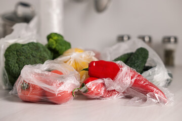 Sticker - Plastic bags and fresh products on white table