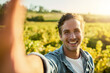 © Lyndon Stratford/peopleimages.com - Time to get my harvest on. Shot of a young man taking a selfie while working on a farm.