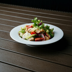 Wall Mural - A closeup of a salad in a white bowl