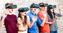 Surprised Friends Exploring Metaverse On Vr Glasses - Virtual Reality And Wearable Tech Concept With Happy People Having Fun Together With Headset Goggles - Digital Generation Trends On Bright Filter