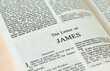 Apostle James epistle letter open Holy Bible Book close-up. New Testament Scripture. Studying the Word of God Jesus Christ. Christian biblical concept of love, faith, trust.