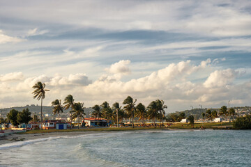 The cloudy blue sky over the sea and tennis beach in Matanzas, Cuba