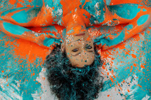 Unusual Remarkable Impressive Portrait Of Adult Brunette Curly Woman, Dots Of Green Turquoise And Orange Color Paint, Decorative Creative Expressive Abstract Body Painting Art, Make Up