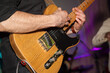 © Andrey Frolov - A man plays the guitar in close-up. Hands playing guitar close-up.