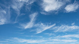 Fototapeta Niebo - WIspy clouds and blue sky suitable for background or sky replacement