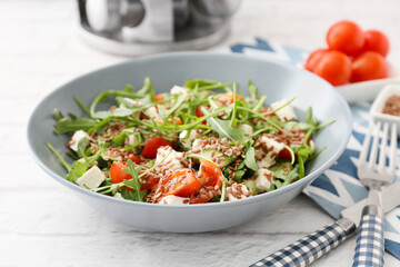 Bowl with tasty healthy vegetable salad on table