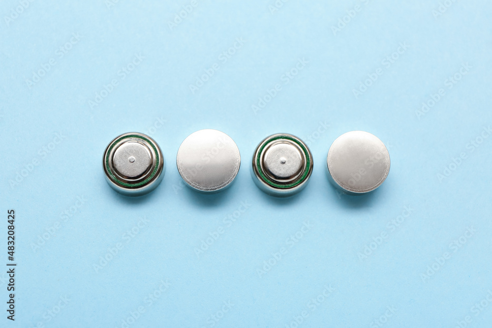 Lithium button cell batteries on blue background
