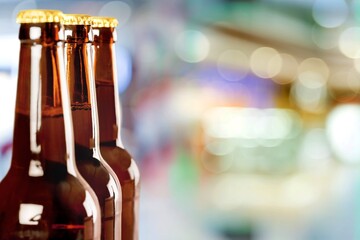 Poster - Fresh beer in glass bottle in a bar