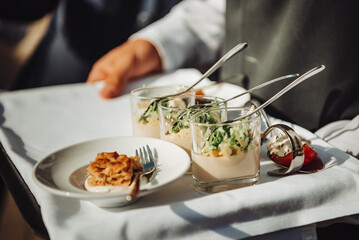 Wall Mural - snacks on a tray at the waiter. Banquet 