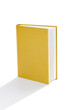 Open yellow cover book on white background