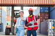 © Thanumporn - Businesswoman and engnineer showing thumbs up with laptop working at warehouse container cargo ship import export industry.