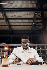 Wall Mural - african engineer working manually with tools