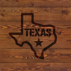 Wall Mural - texas state symbol branded on old wood wall