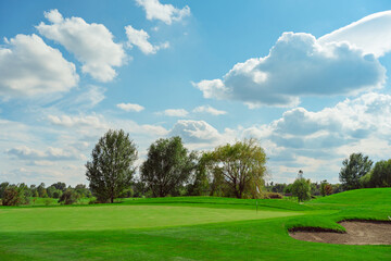 landscape. golf course and sky with clouds. lawn grass.