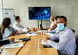 © Prostock-studio - New Normal. Diverse Business People In Face Masks Having Conference In Office
