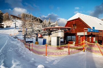 Sticker - Bottom station of ski-lift chair at resort Snowland Valca in winter season.