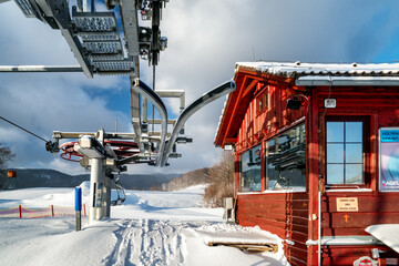 Wall Mural - Upper station of ski-lift chair at resort Snowland Valca in winter season.