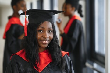 Wall Mural - portrait of multiracial graduates holding diploma