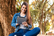 © Vergani Fotografia - happy woman using tablet for fun in the park