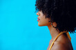 © Carlos David - profile closeup young beautiful black woman with curly hairstyle posing in studio